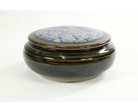 Round ceramic bowl with cover, title: Take it easy, hire a Champ,  sign: Han Boerrigter (b. 1935), dated. 2002, diam. 19 cm.R