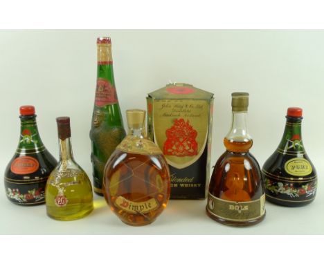 A bottle of Dimple Scotch whisky, triangular decanter with wire net, paper labels, level to top of shoulder, in original box,