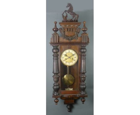 Two Vienna wall clocks, conventional forms, one with pediment carved as a rearing horse, the other with an eagle, both with g