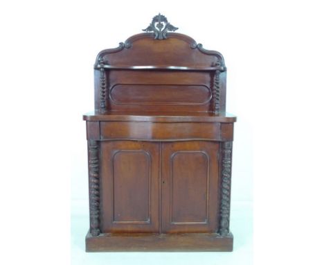 A Victorian mahogany chiffonier, the gallery back with carved surmount and single shelf, below twin cupboard doors enclosing 