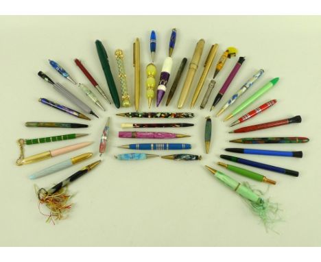 A collection of mostly mid 20th century propelling pencils, including marbled plastic examples, one marked Royal Sovereign E 