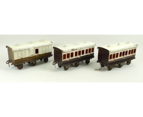 A group of three large scale 2.75 inch coaches, circa 1930, comprising two First Class passenger coaches, and L&NWR Guard coa