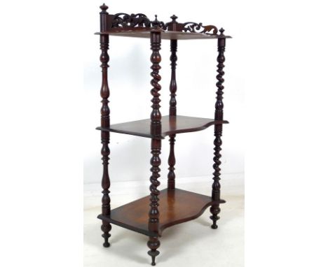 A Victorian mahogany whatnot with pierced fretwork sides to top shelf, barley twist supports, three shelves, 50 by 31 by 94cm