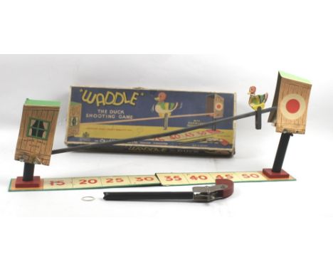 A Chad Valley 'Waddle the Duck' duck shooting game, with instructions, in its original box.