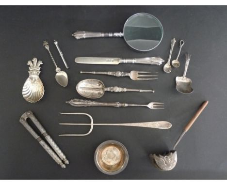 A group of silver items comprising two caddy spoons, one with Prince of Wales crest, 8.5cm, toasting fork with bright cut dec