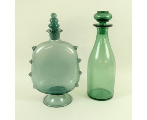 An 18th century blue Waldglass decanter, its lozenge shaped body decorated with eight punts and raised on a spreading folded 