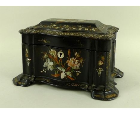 A Victorian papier mache tea caddy, black japanned and and decorated with a floral design in mother of pearl, contains two si