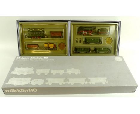 A Marklin HO gauge boxed double set, 0050, Jubilee 50th anniversary '50 Jahre Marklin HO', comprising 0-4-0 tank loco and ten