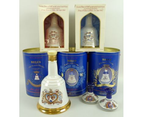 A set of six commemorative Scotch Bell whisky decanters, still full, commemorating the births of Prince William, Prince Harry