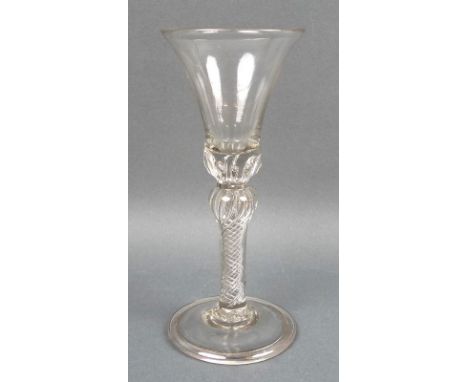 A George II wine glass, the bell shaped bowl above a single knopped multi air twist stem extending into the bowl, raised on a