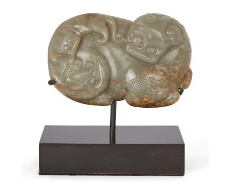 Property of a Gentleman (Lots 55-80)A Chinese celadon and russet jade 'Buddhist lion' dish, Ming dynasty, 17th century, carve