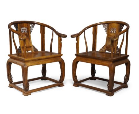 A pair of Chinese rosewood horseshoe backed armchairs, quanyi, 20th century, with horseshoe top rail terminating in scroll en