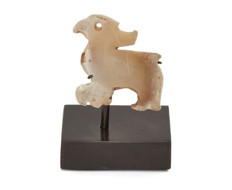 Property of a Gentleman (Lots 55-80)A Chinese celadon jade 'bird' pendant, late Shang/early Western Zhou dynasty, carved with