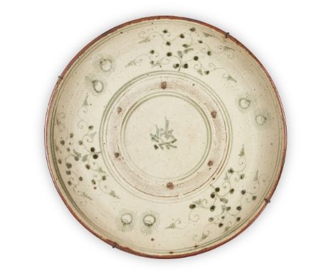 A large Annamese blue and white dish, 14th/15th century, painted to the central reserve with a stylised character inside an u