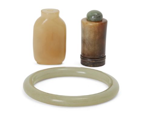 Two Chinese jade snuff bottles and a bangle, Late Qing Dynasty, comprising a tapering cylindrical bottle with no neck, stoppe