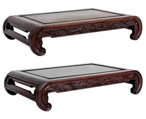 A pair of Chinese 'chilong' hongmu scholar's stands, Republic period, each with a single-plank top with raised central area s