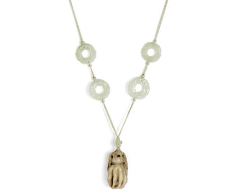 A Chinese finger citron pendant and white jade discs, 17th - late 19th century, the finger citron, carved in naturalistic for