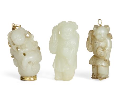 Three Chinese celadon jade 'boy' carvings, 19th century, one carved with a boy hugging a double gourd, mounted with gold as a