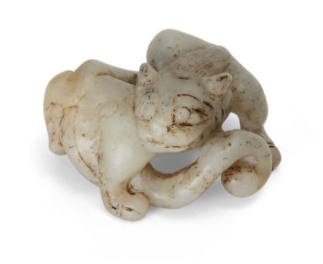 A Chinese greyish green jade chilong carving, 19th century, carved in a coiled pose, 5cm wide十九世紀 玉雕螭龍把件Mottled inclusions, b
