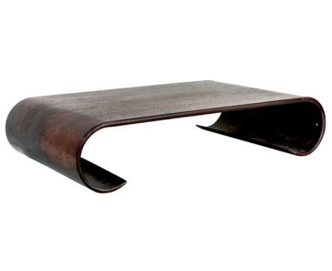 A Chinese huali scroll-form stand, Republican period, carved from a single piece of wood, the stand with flat top and elegant