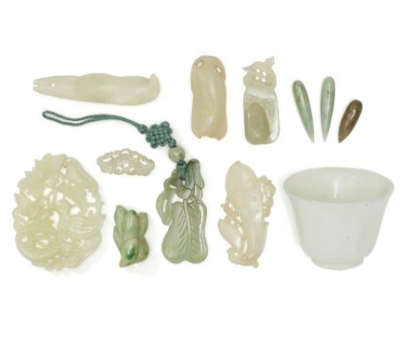 A group of Chinese jade and jadeite carvings , 19th and 20th century, comprising: four reticulated pendants, the largest 5.6c
