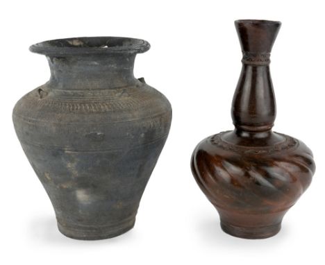 Two Khmer Angkorian vases, circa 11th century, the first of baluster form, with incised decoration to shoulder and neck, with