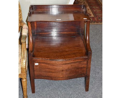 A George III mahogany commode of two-tier form, with shaped gallery on square formed legs, 55cm by 50cm by 75cm