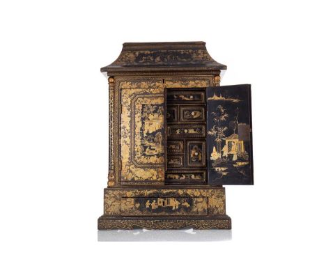 CHINESE EXPORT LACQUERED TABLE CABINET 19TH CENTURY with profuse and elaborate gilt decoration overall, including dragons to 