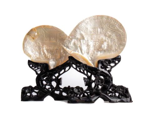 PAIR OF CHINESE CARVED MOTHER OF PEARL SHELLS  LATE 19TH / EARLY 20TH CENTURY carved with scenes of figures in architectural 