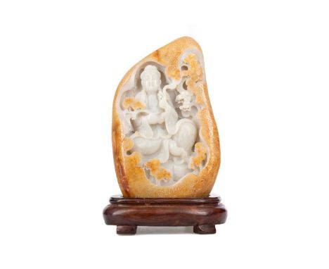 LARGE CHINESE CARVED JADE GUANYIN BOULDER 20TH CENTURY celadon and russet toned, relief carved with Guanyin in seated lotus p