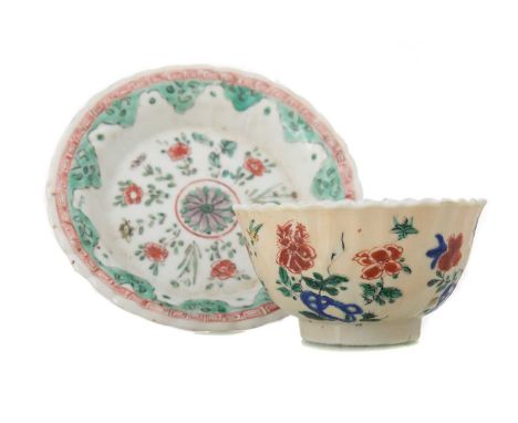 CHINESE FAMILLE VERTE TEA BOWL AND SAUCER KANGXI PERIOD 1662 - 1722  decorated with flowers and foliage, cafe-au-lait glazed 