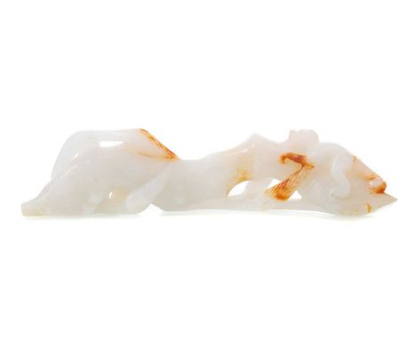 CHINESE WHITE JADE CARVING 19TH/20TH CENTURY modelled with a monkey on bamboo shoot, featuring russet inclusions13.5cm longNo