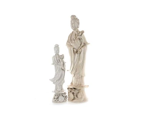 CHINESE BLANC DE CHINE GUANYIN  20TH CENTURY  the figure modelled holding on a flower and standing on a lotus pedestal base, 