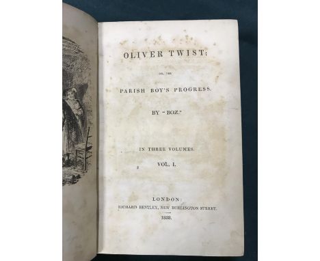 [Dickens, Charles] Oliver Twist, 3 volumes, first edition in book form, first issue, with the 'Fireside' plate, half-titles t