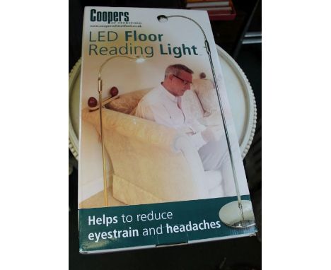 An LED brass&nbsp; floor reading light by "Coopers", brand new still boxed.
