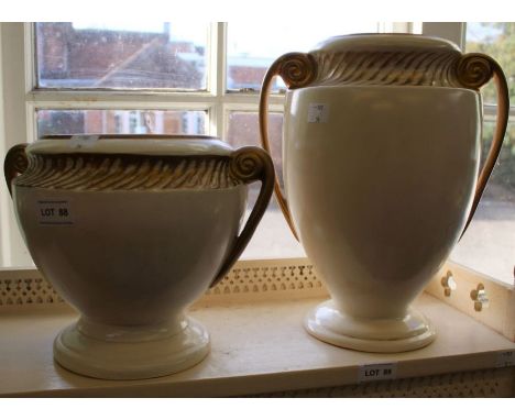A pair of modern ceramic cream &amp; gilt pots