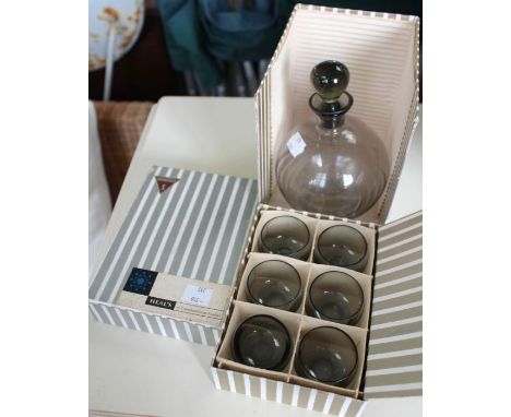 A boxed new small decanter with six shot glasses, by Sussmuth, retailed by Heal's.