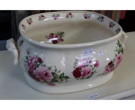 A ceramic footbath with rose decoration