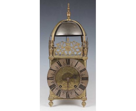 A late 19th century brass lantern clock with eight day movement striking on a bell, the backplate stamped 'W &amp; H Sch' (Wi