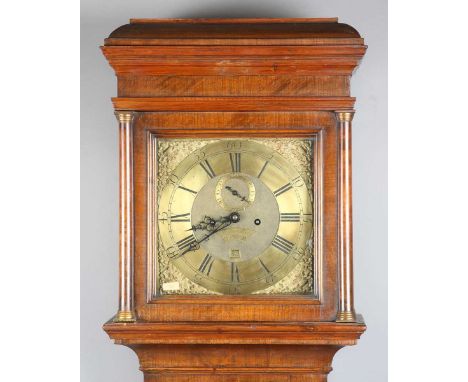An 18th century and later walnut longcase clock with eight day movement striking on a bell, the 12-inch square brass dial wit