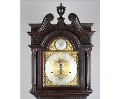 An early 20th century mahogany longcase clock with eight day three train movement chiming on nine gongs with pull repeat mech