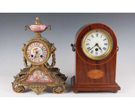 A late 19th century French ormolu and porcelain mantel clock with eight day movement striking on a bell, the case with urn su