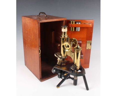 A late Victorian gilt lacquered and black enamelled monocular microscope by J. Swift, London, with rack and pinion focusing, 