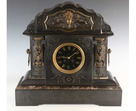A late 19th century slate mantel clock with French eight day movement striking on a gong, the dial with gilt Roman hour numer