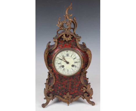 A late 19th century French brass mounted and red tortoiseshell boulle cased mantel clock with eight day movement striking on 