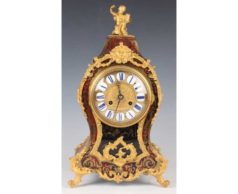 A late 19th century French gilt metal mounted and red tortoiseshell boulle work mantel clock with eight day movement striking