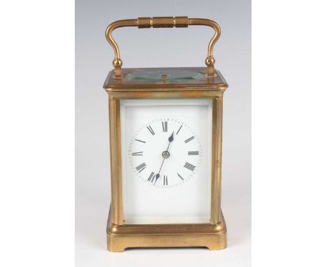 A late 19th/early 20th century French brass carriage clock with eight day movement striking hours and half hours and repeatin