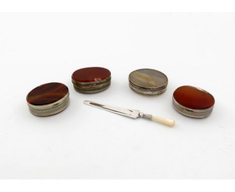 four 19th century base metal mounted agate boxes, oval form, the sides with engine-turned decoration, agate covers and bases,