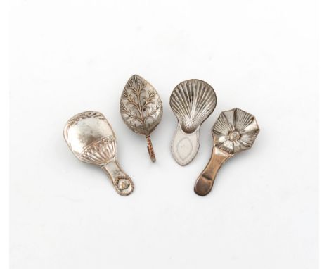 λ A small collection of four old Sheffield plated caddy spoons, comprising: one of leaf form, two with fluted bowls and one o