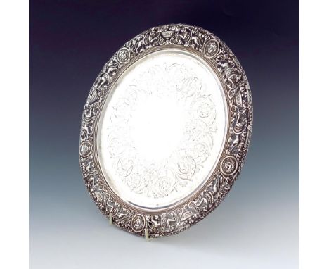 A Victorian silver salver with a cast border, by Stephen Smith, London 1867, circular form, the centre engraved with eagles a